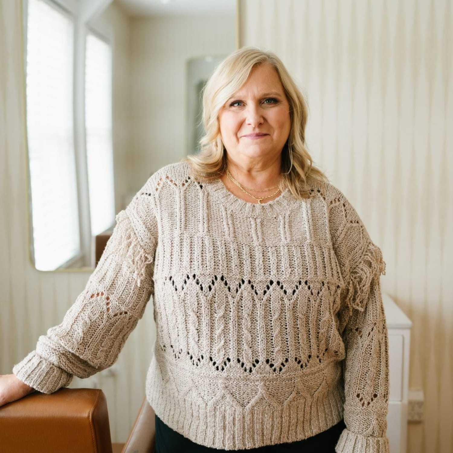 Portrait of Cheryl, a professional stylist at 1604 Salon, showcasing their expertise and style.