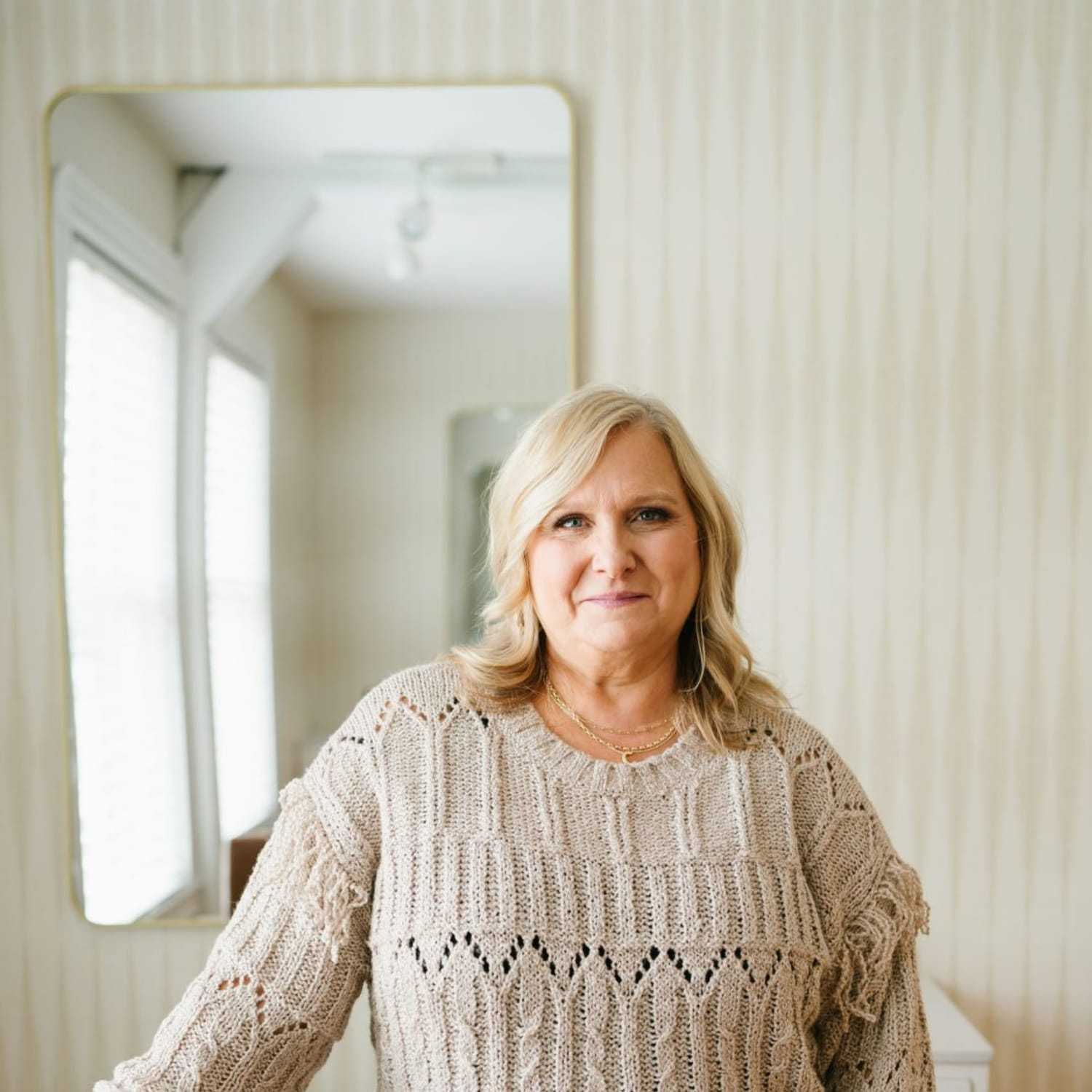 Portrait of Cheryl, a professional stylist at 1604 Salon, showcasing their expertise and style.